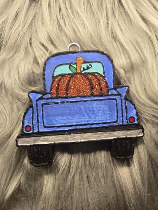 Vintage truck with pumpkin